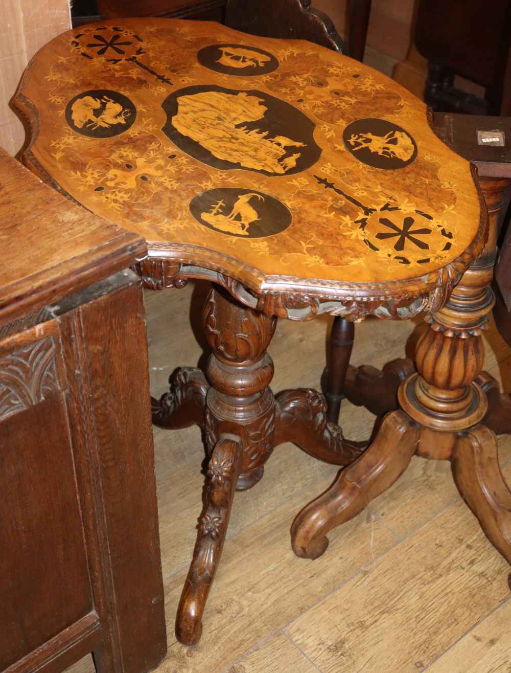 A 19th century Black Forest marquetry inlaid tripod table, W.74cm, D.54cm, H.75cm